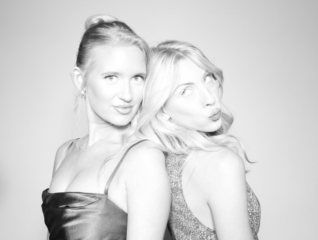 Guests posing at the Captics photo booth during a anniversary celebration in Cambridge, Ontario