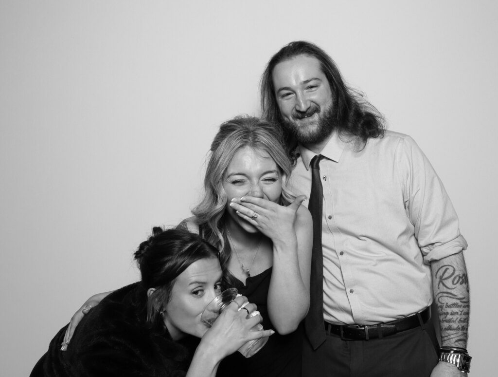 Guests posing at the Captics photo booth during a anniversary celebration in Cambridge, Ontario