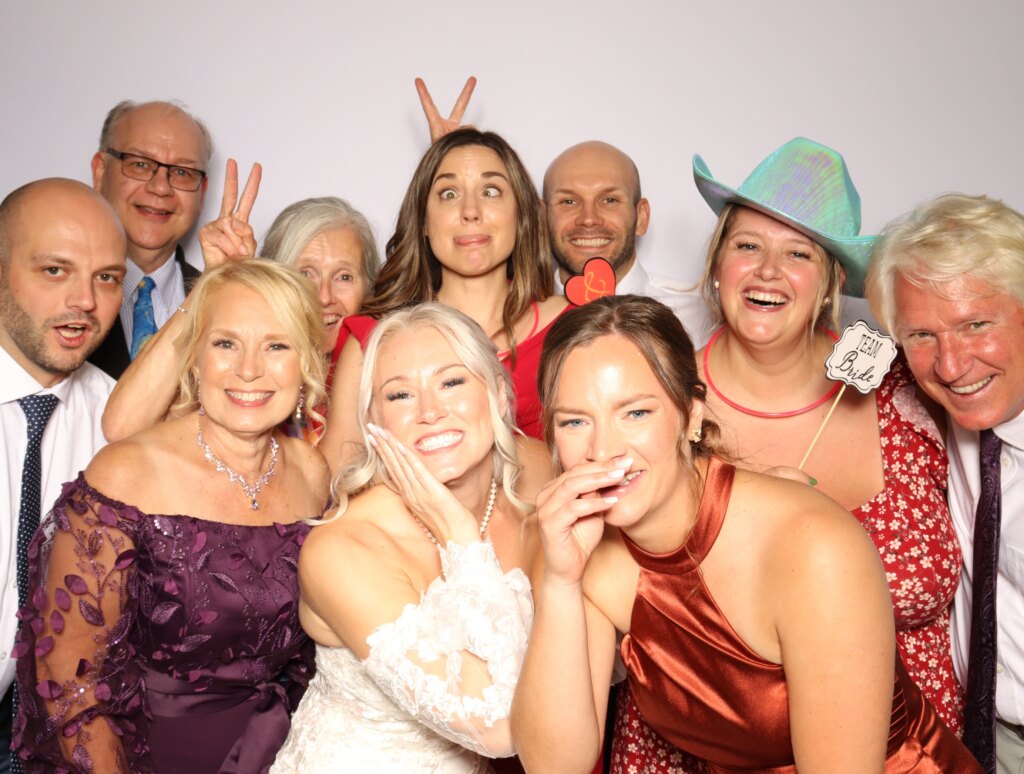 Friends having fun at the Captics photo booth at a holiday party in Galt, Ontario