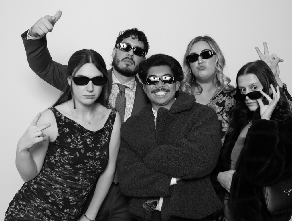 Guests posing at the Captics photo booth during a wedding in Cambridge, Ontario
