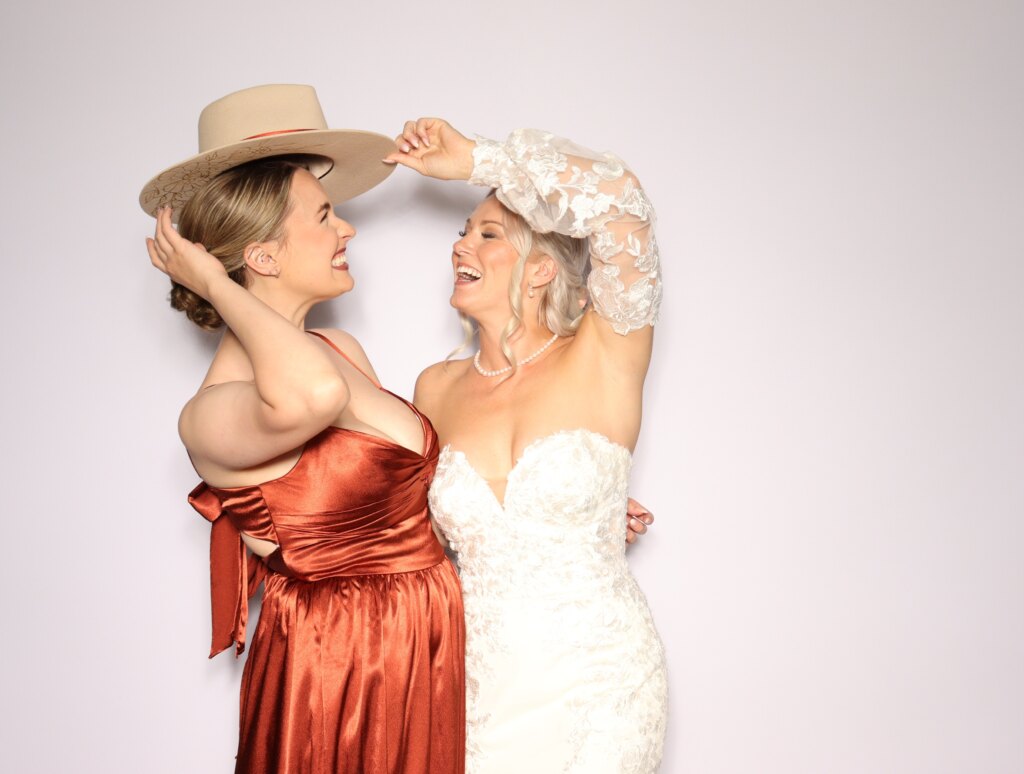 Friends having fun at the Captics photo booth at a wedding reception in Galt, Ontario