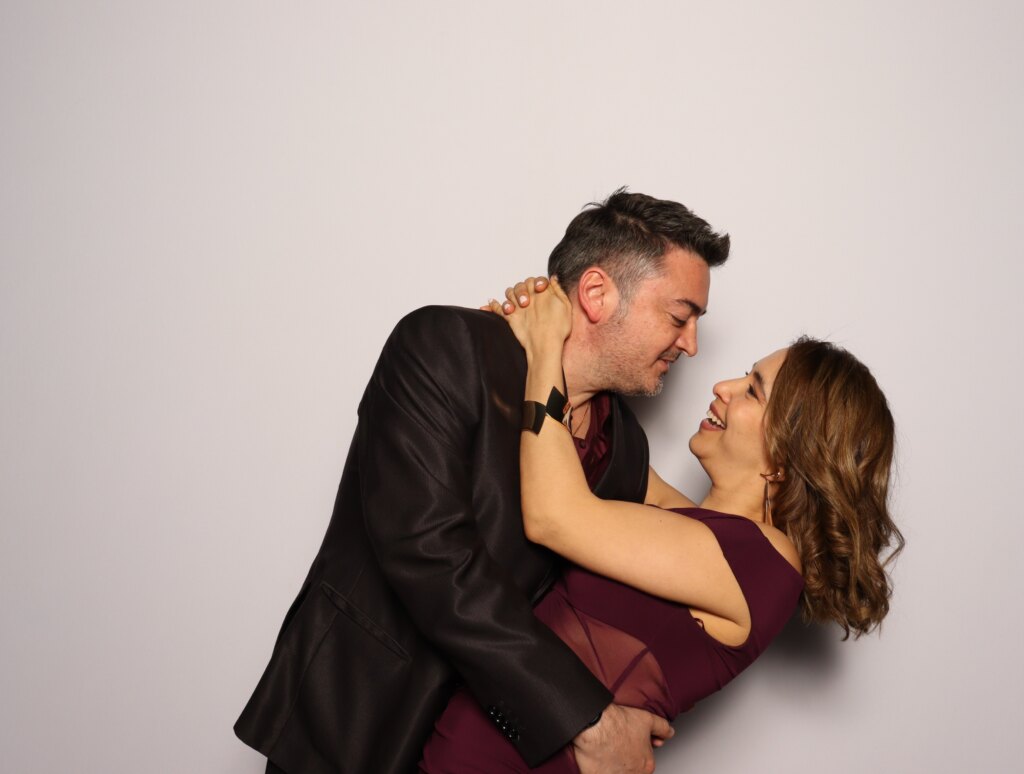 Friends having fun at the Captics photo booth at a wedding reception in Galt, Ontario